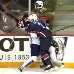 Slovenia's Anze Kopitar (L) gets checked by Keith Ballard of the United States during the preliminary round of the 2008 IIHF World Hockey Championships at the Halifax Metro Centre in Halifax on Scotia May 4, 2008. AFP PHOTO/Timothy A. CLARY (Photo credit should read TIMOTHY A. CLARY/AFP/Getty Images)